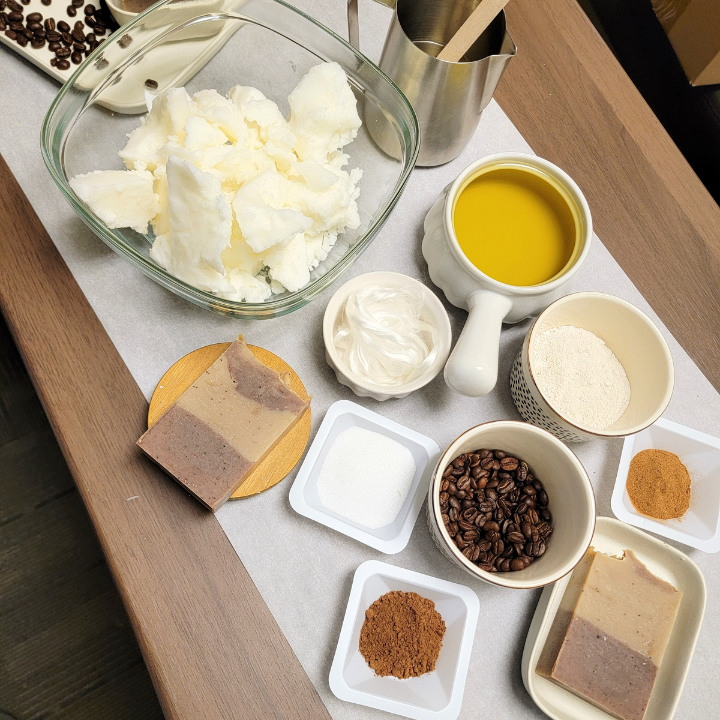 Elevate your skincare with our Coffee Spice Natural Handmade Soap, crafted with ground coffee, rich cocoa, silk, and soothing aloe vera. This luxurious dye-free specialty soap gently exfoliates, buffs away dead skin, and nourishes with its luxurious, skin-loving ingredients. Handmade using the traditional cold-process method, it delivers a rich lather for a deep yet gentle cleanse.