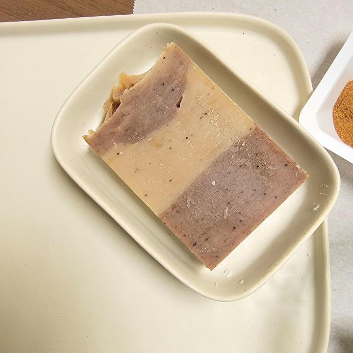 Wake up your skin with the nourishing power of coffee, cocoa, and aloe vera in our Coffee Spice Natural Soap. Designed for those who love nurturing skincare, this specialty soap exfoliates, hydrates, and smooths without artificial colors or fragrances. The addition of silk fibers enhances lather, creating a luxuriously creamy wash that leaves skin soft and revitalized.