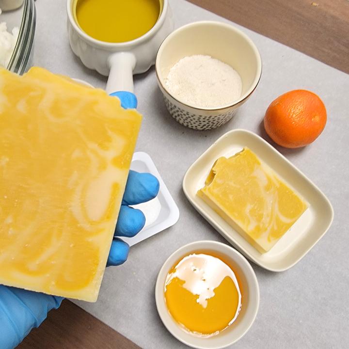 Indulge in the uplifting freshness of Honey Tangerine Natural Handmade Soap, crafted with skin-loving plant-based oils and butters for a gentle, hydrating cleanse. Scented with a bright essential oil blend of tangerine, litsea cubeba, and bergamot, this luxurious soap awakens your senses while honey deeply nourishes and silk fibers create a rich, creamy lather. Infused with yellow clay and annatto seed oil, it naturally purifies and leaves skin feeling soft and radiant.