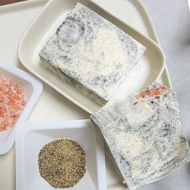 Our natural handmade salt soap is crafted with a thoughtful blend of nature-sourced ingredients, for a luxurious and nourishing cleansing experience. Rich botanical oils and butters provide deep hydration, while plant-based extracts soothe and protect the skin. We carefully select each ingredient—from creamy coconut milk and raw honey to mineral-rich clays and antioxidant-packed botanicals—to create a formulation that is both gentle and effective. No synthetic fragrances, no artificial colors.