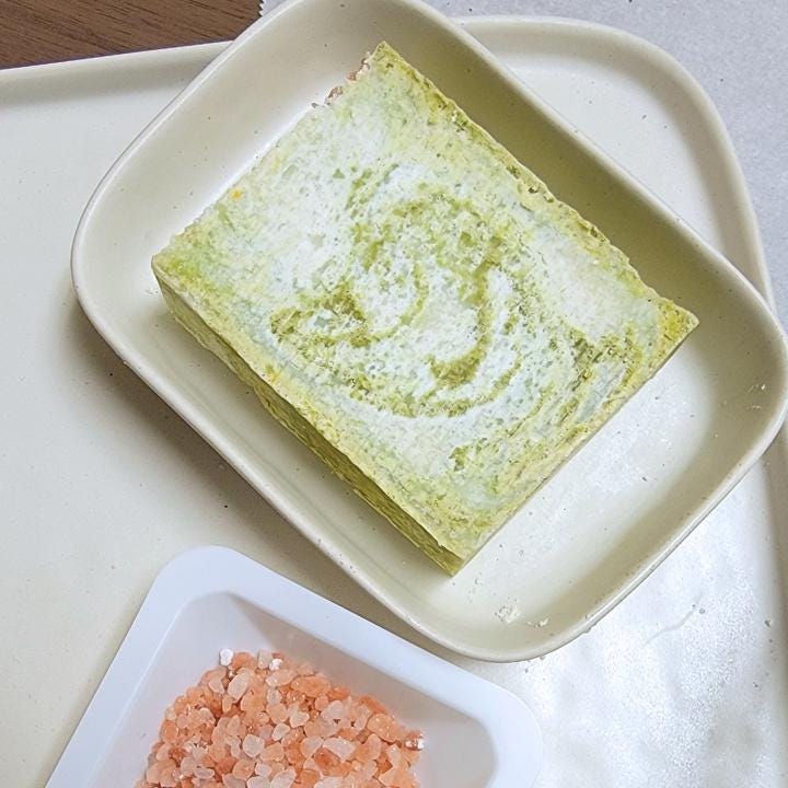 Our natural handmade soap is crafted with a thoughtful blend of nature-sourced ingredients, for a luxurious and nourishing cleansing experience. Rich botanical oils and butters provide deep hydration, while plant-based extracts soothe and protect the skin. We carefully select each ingredient—from creamy coconut milk and raw honey to mineral-rich clays and antioxidant-packed botanicals—to create a formulation that is both gentle and effective. No synthetic fragrances, no artificial colors.